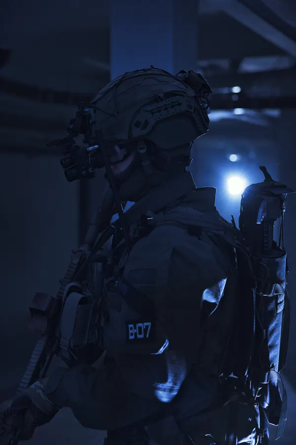 Operator from behind under cold interior light, back panel and pack