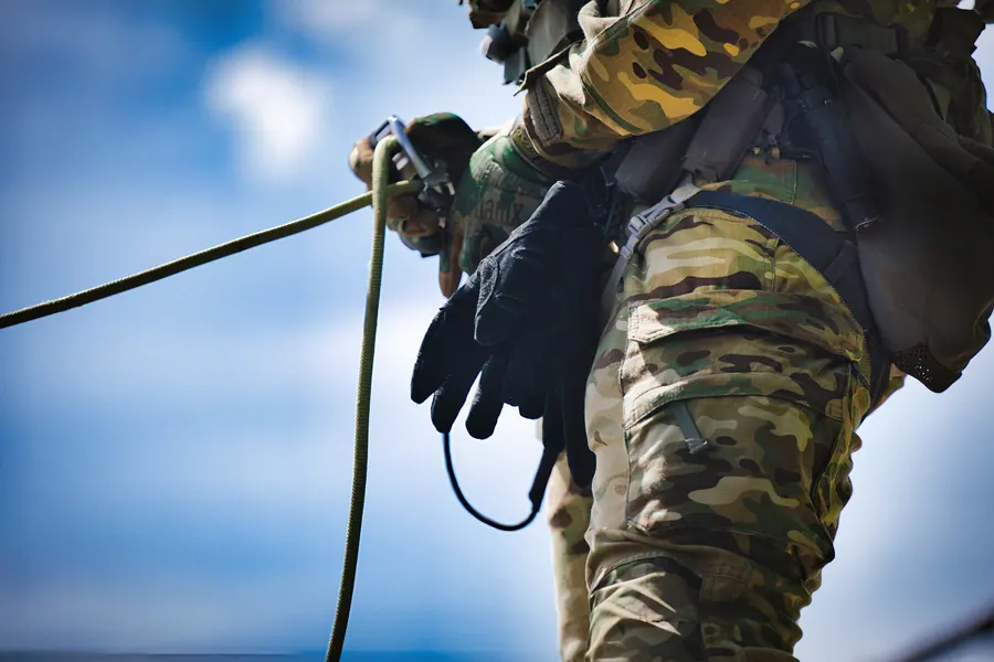 Rope work at the hip against a bright sky