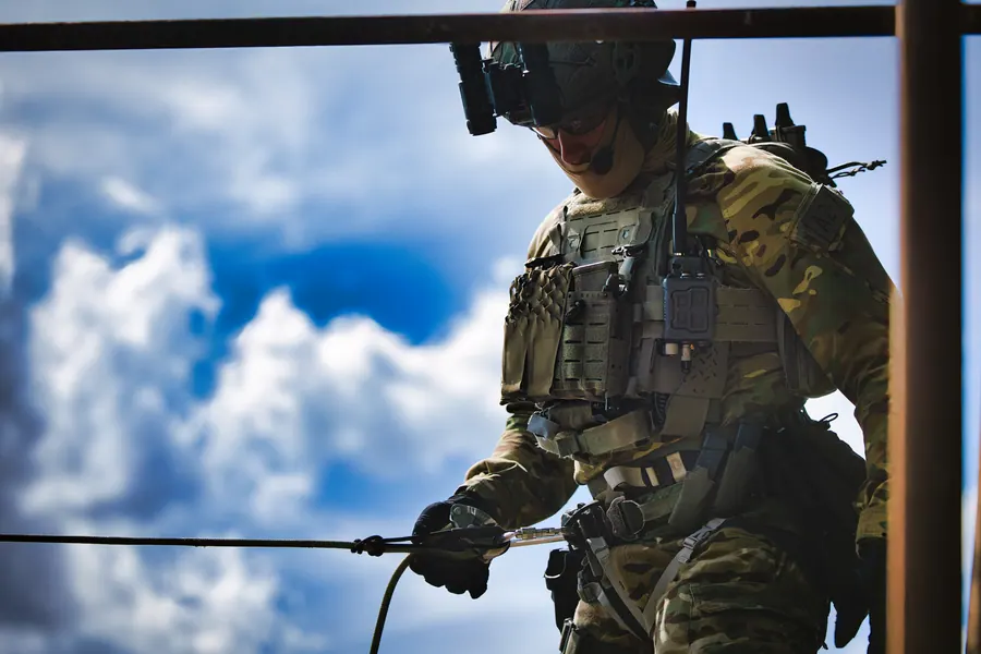 Operator working a rope in MultiCam against a bright sky